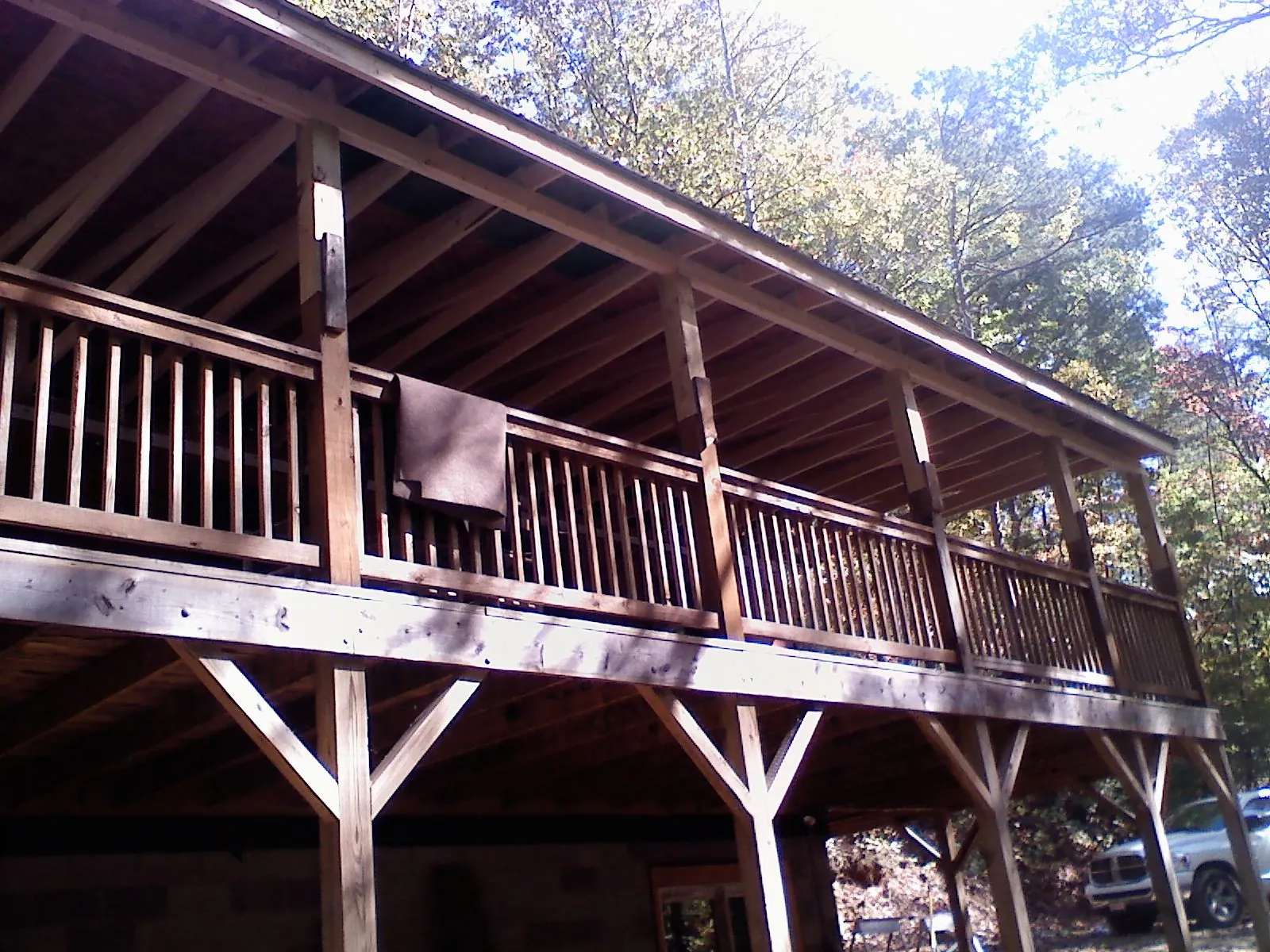 Timber framing under a new elevated porch and deck — Roof Leak Repair in Old Station by Roofing Brothers